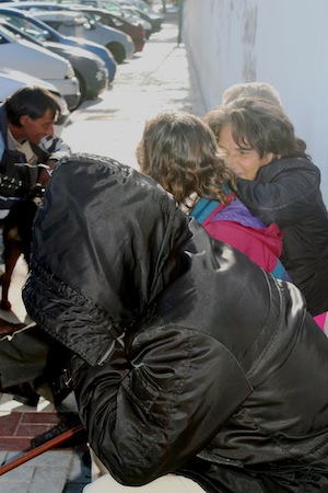 Homeless people share experiences near a shelter in Málaga, Spain